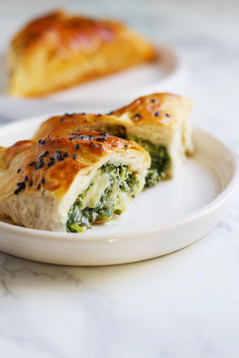 roll filled with spinach on white plate healthy meals