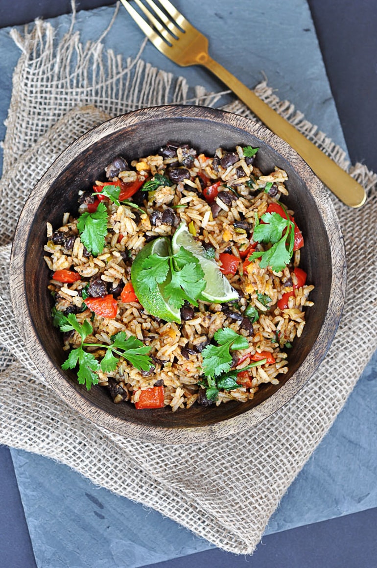 black beans and rice dish on table with fork