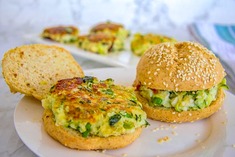 green and yellow halloumi burgers on white plate