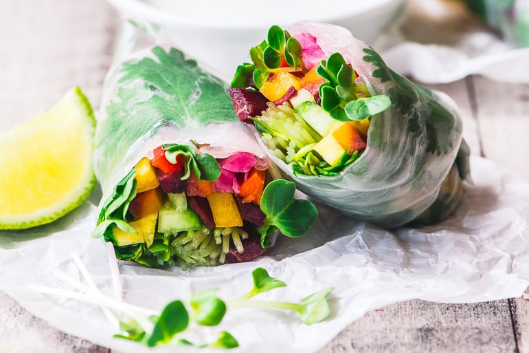 Fresh vegetables rolled in rice paper summer rols with lime 