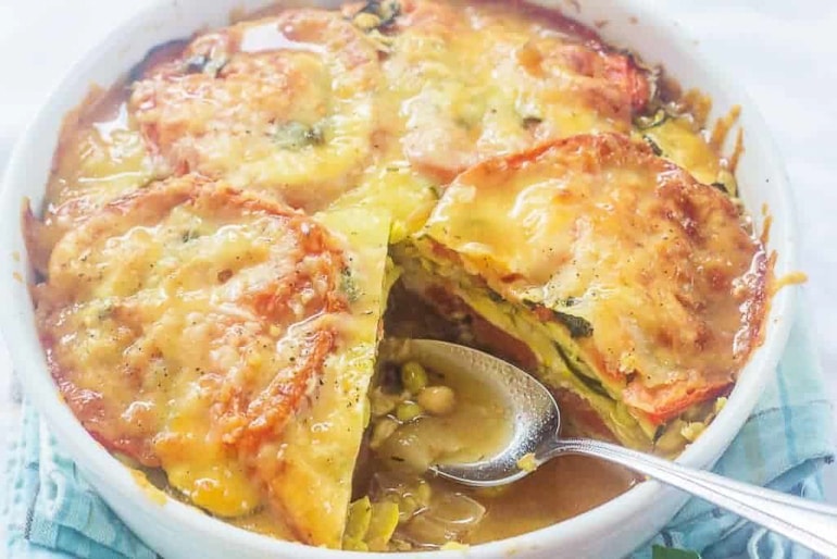 layered casserole with serving spoon sticking out