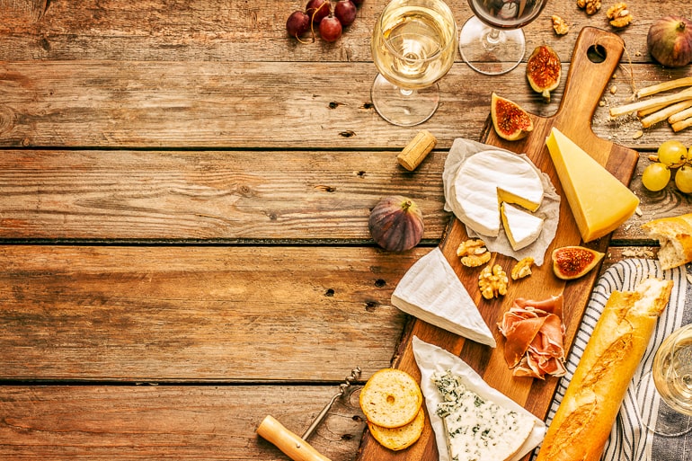 various cheeses on wooden table date night at home ideas