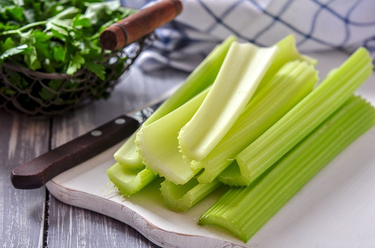 sticks of celery in a small pile on counter top