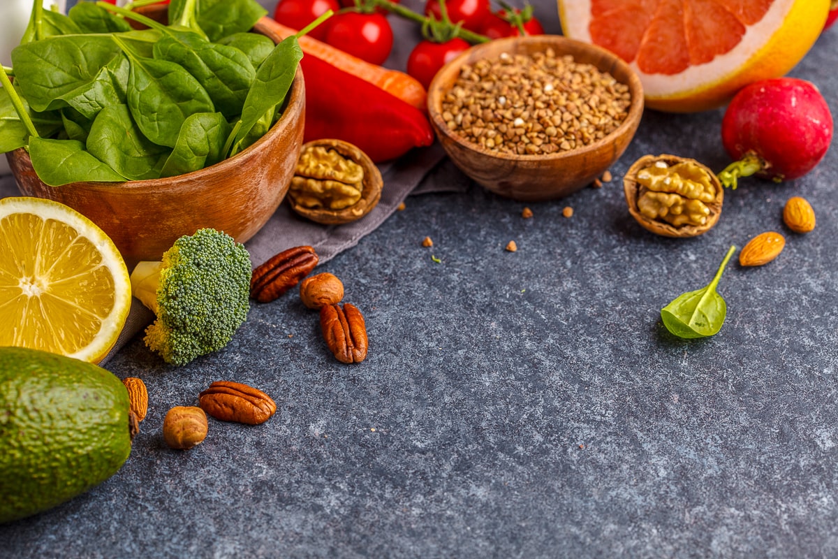 vegetables and nuts on dark counter top alkaline foods