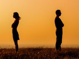 man and woman standing with orange sunset behind how to stop fighting in a relationship